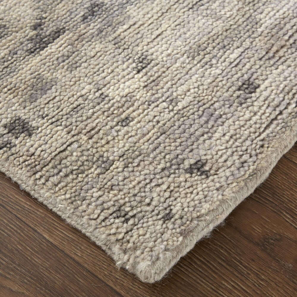 Ivory And Gray Wool Abstract Hand Knotted Area Rug | 9' x 13' on wooden floor, showcasing its texture and color.