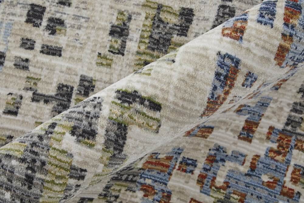 Ivory Green and Blue Abstract Power Loom Area Rug | 9' x 13' detailed texture and color pattern close-up.