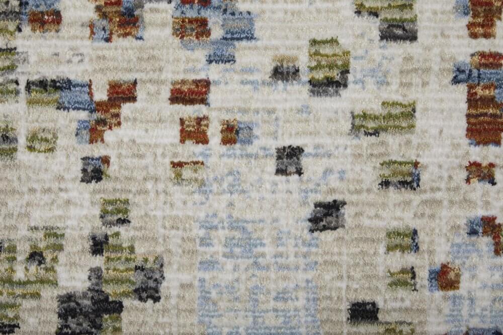 Ivory Green and Blue Abstract Power Loom Area Rug | 9' x 13' close-up with texture and color details.