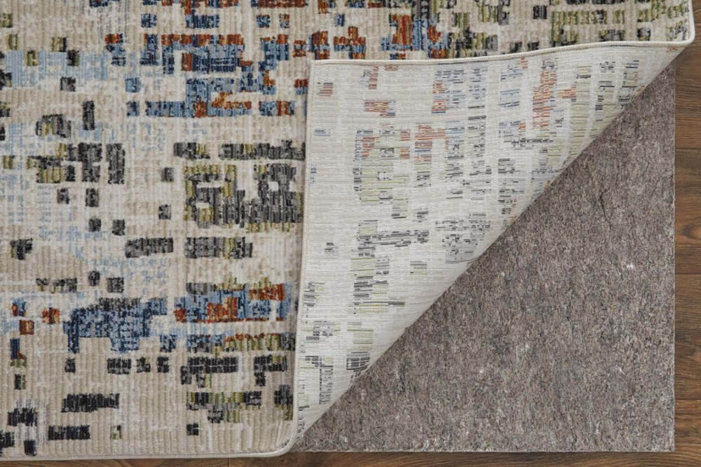 Ivory Green and Blue Abstract Power Loom Area Rug | 9' x 13' showing the patterned top and backing detail.