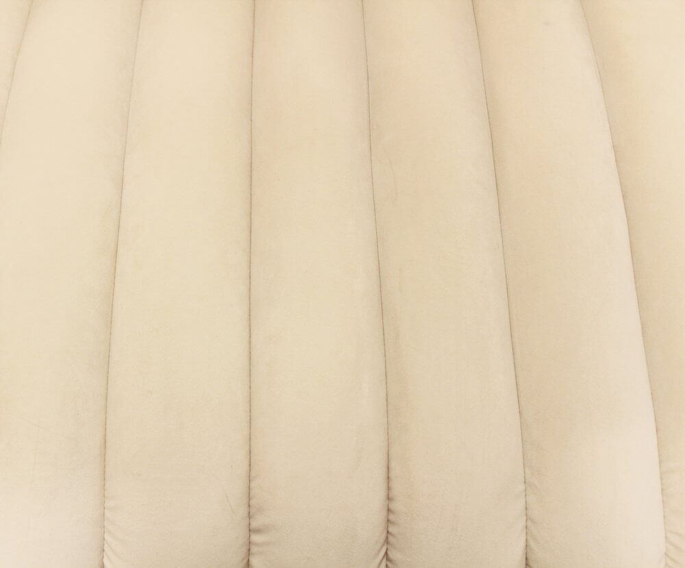 90" Ivory Velvet Sofa And Toss Pillows With Gold Legs close-up of soft ivory velvet upholstery.