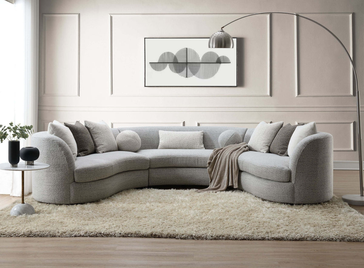 Ivria Gray Bouclé Sectional Sofa – Curved Modular Sofa with 9 Pillows (Modern Statement) in a stylish living room setup.