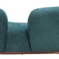 Jamela Teal Curved Sofa with plush shearling-style fabric and brass base, a modern design centerpiece for any living space.