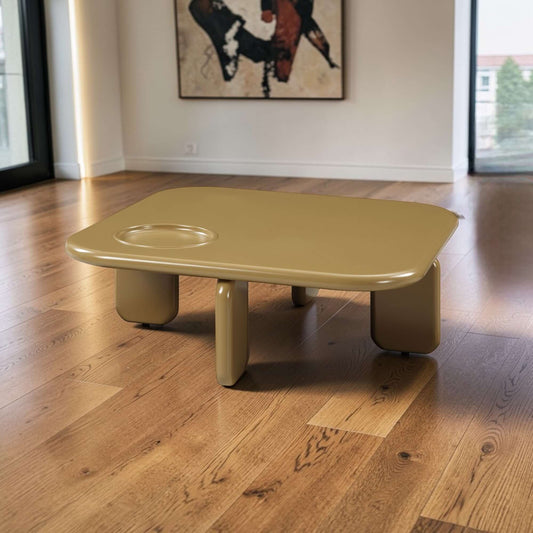 Joane Mustard High Gloss Coffee Table 35"W in a modern living room setting with wooden floors.