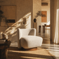 Lisa Gray Tweed Accent Chair in a modern living room setting with natural light and elegant decor.