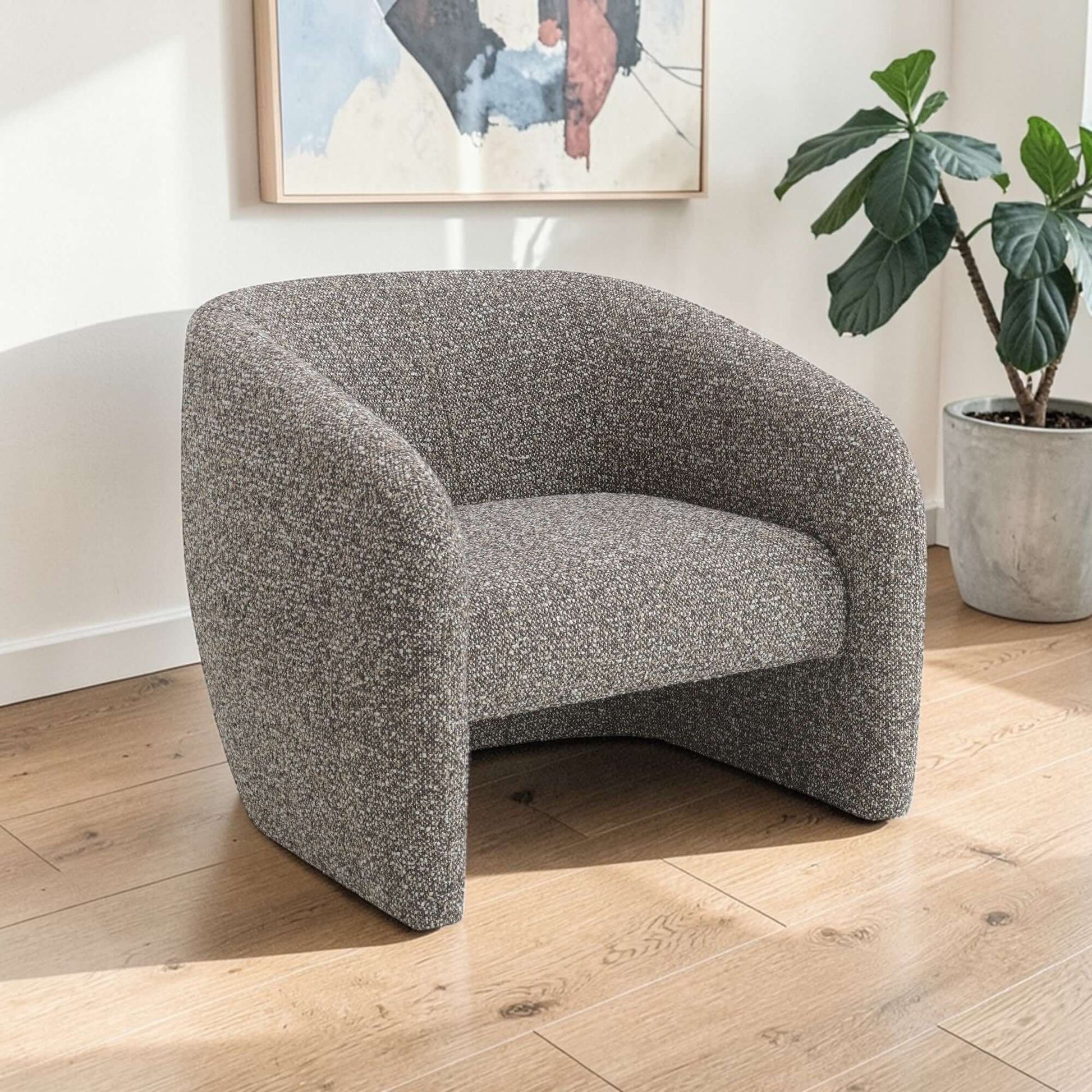 Livia Brown & Gray Tweed Accent Chair in modern living space with natural light and decorative plants.