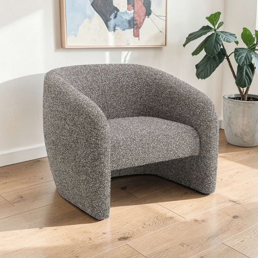 Livia Brown & Gray Tweed Accent Chair in modern living space with natural light and decorative plants.