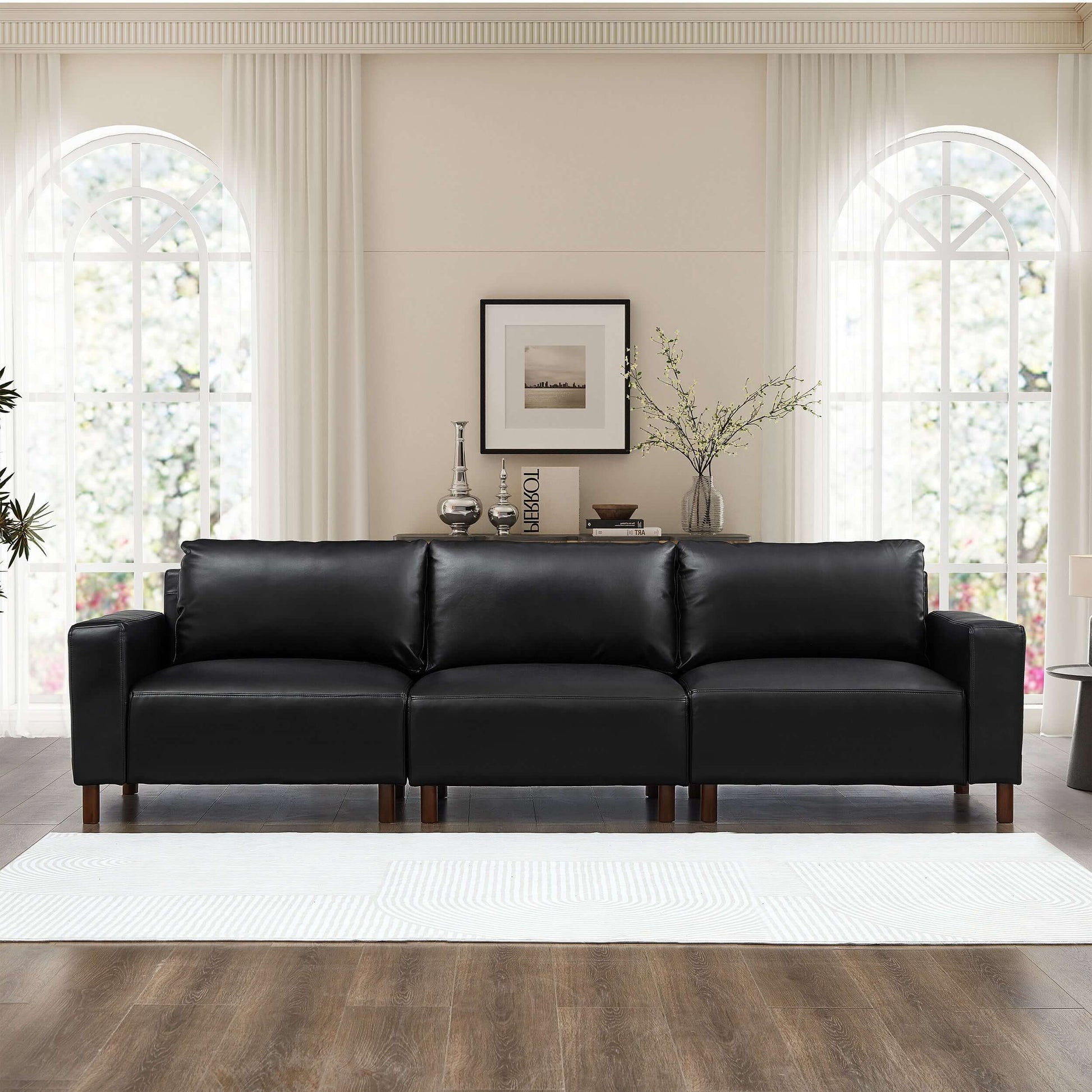 Luxury PU Leather Sofa 112" – Modern Faux Leather 3-Seat Couch with Wood Legs (3 Colors) in a stylish living room.