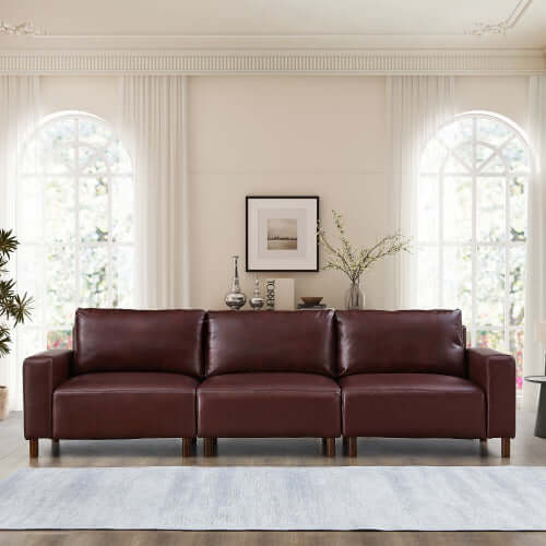 Luxury PU Leather Sofa 112" – Modern Faux Leather 3-Seat Couch with Wood Legs (3 Colors) in a stylish living room setting.