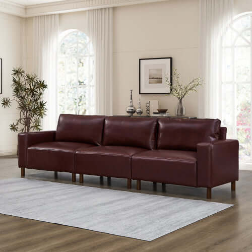Luxury PU Leather Sofa 112" – Modern Faux Leather 3-Seat Couch with Wood Legs (3 Colors) in a stylish living room.