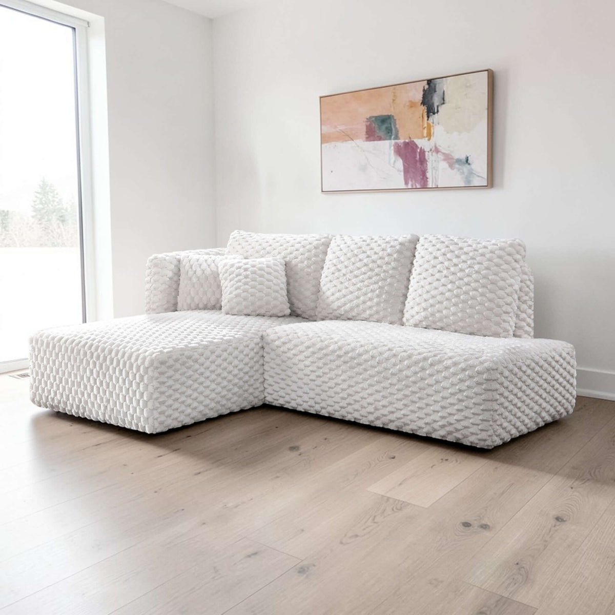 Manya Ivory Corduroy Sectional Sofa – 97” L-Shape Chaise Sofa with Pillows in a modern living room setting.