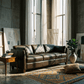 Matias Chocolate Brown Premium Italian Leather Sofa 81" in a stylish living room with natural light.