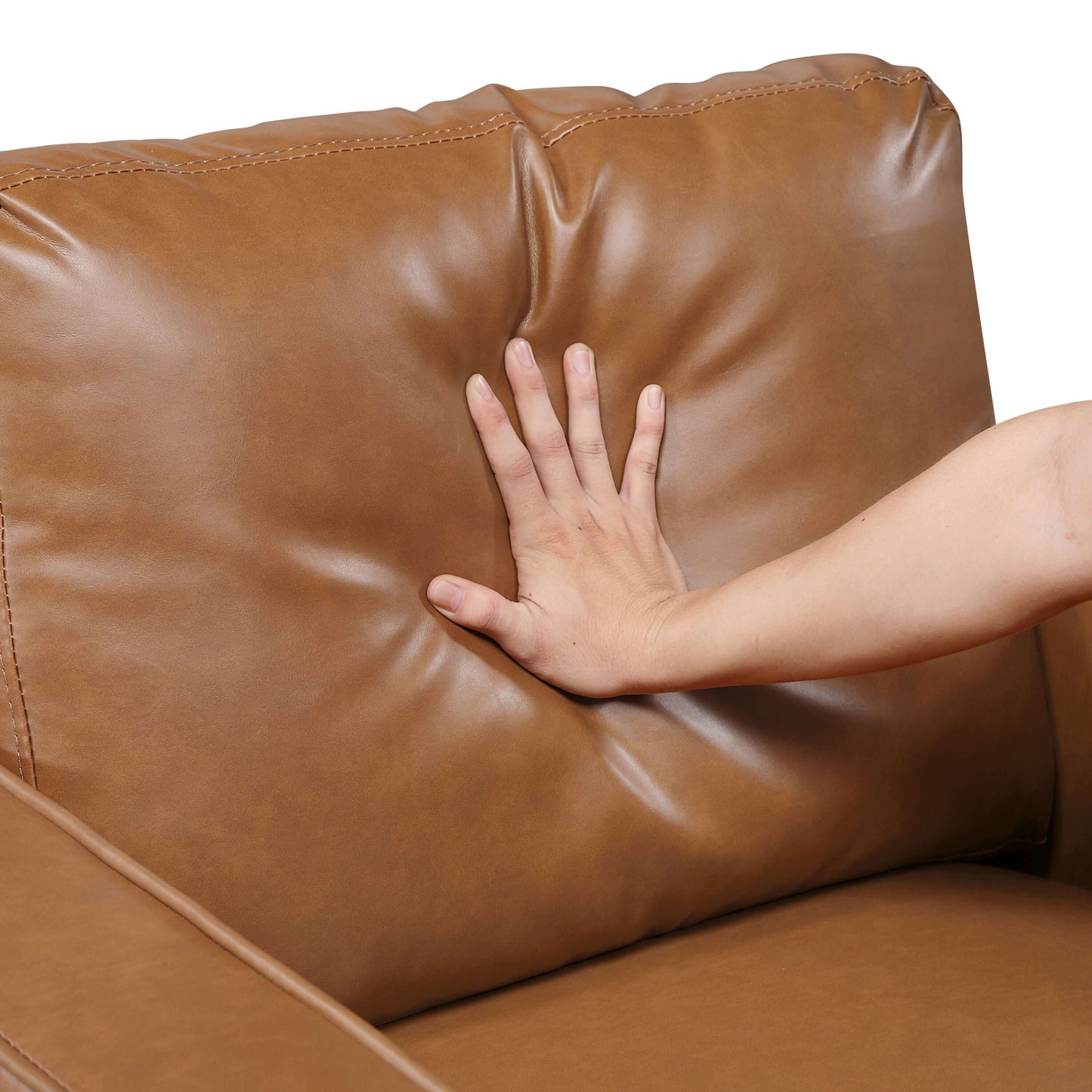 MCM Brown Faux Leather Armchair – Modern Upholstered Accent Chair with a hand resting on its plush cushion.