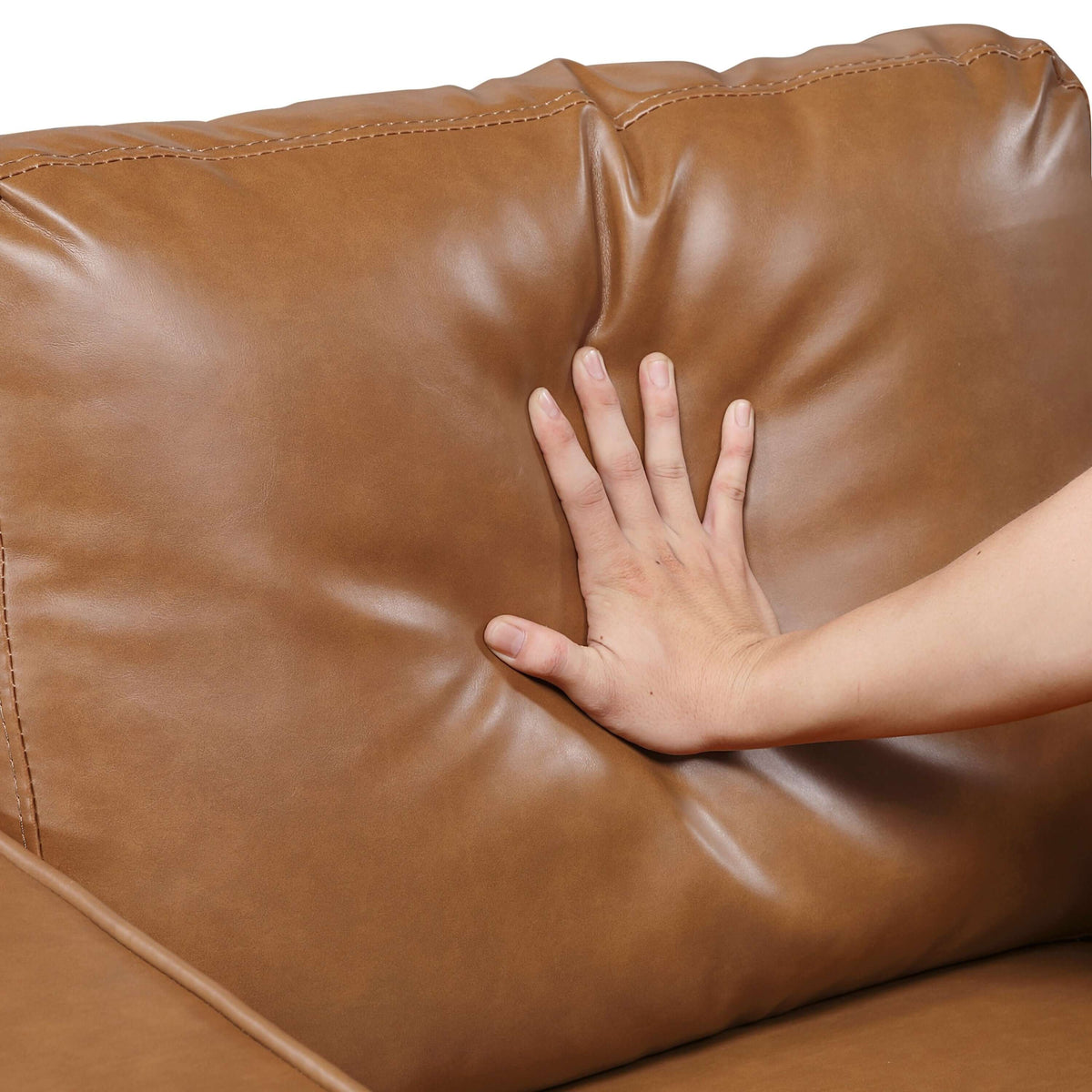MCM Brown Faux Leather Loveseat 54" – Modern Compact 2-Seat Sofa cushion being pressed for comfort