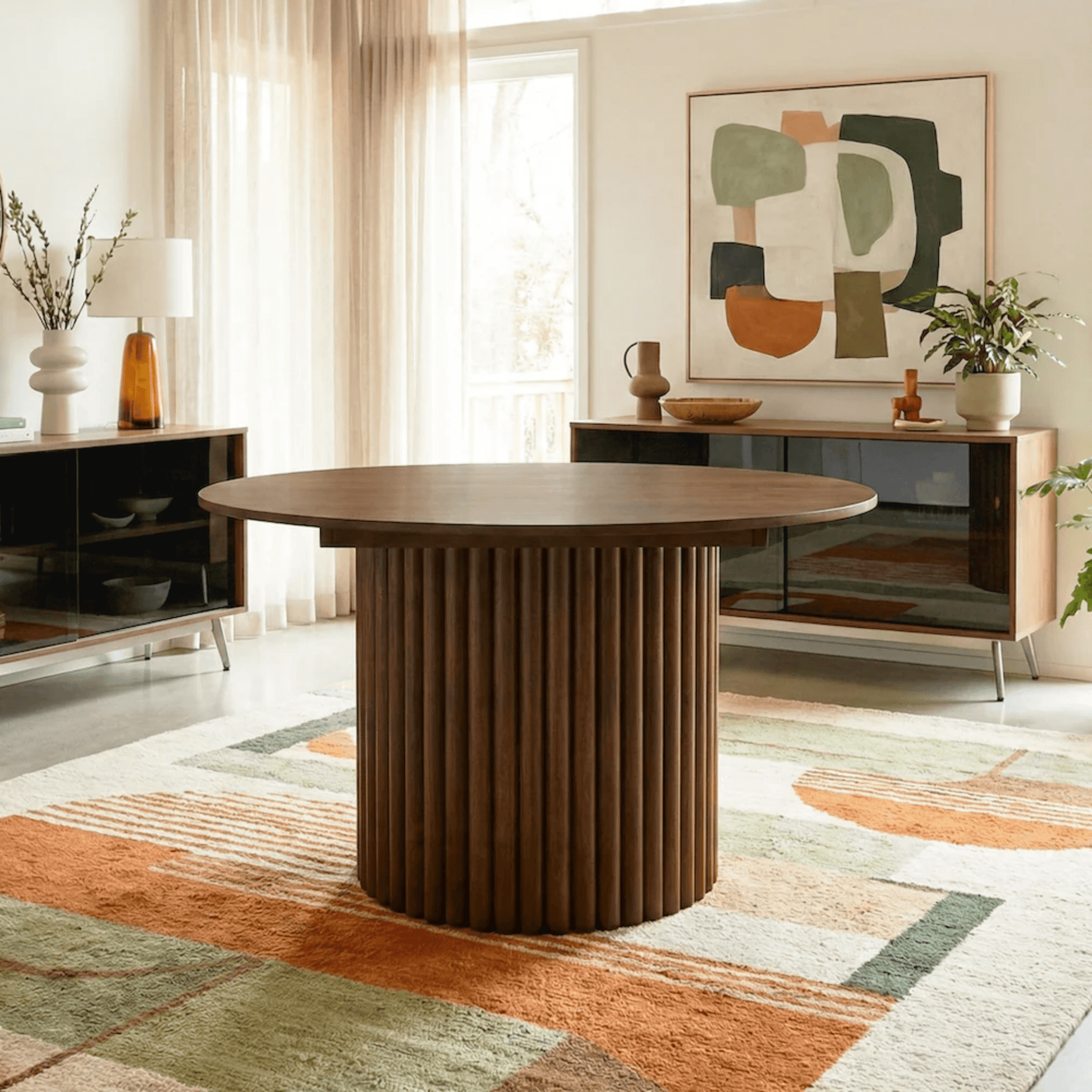 Merlin 35" Solid Wood Round Dining Table in Walnut with Ribbed Pedestal Base showcased in elegant dining room setting.
