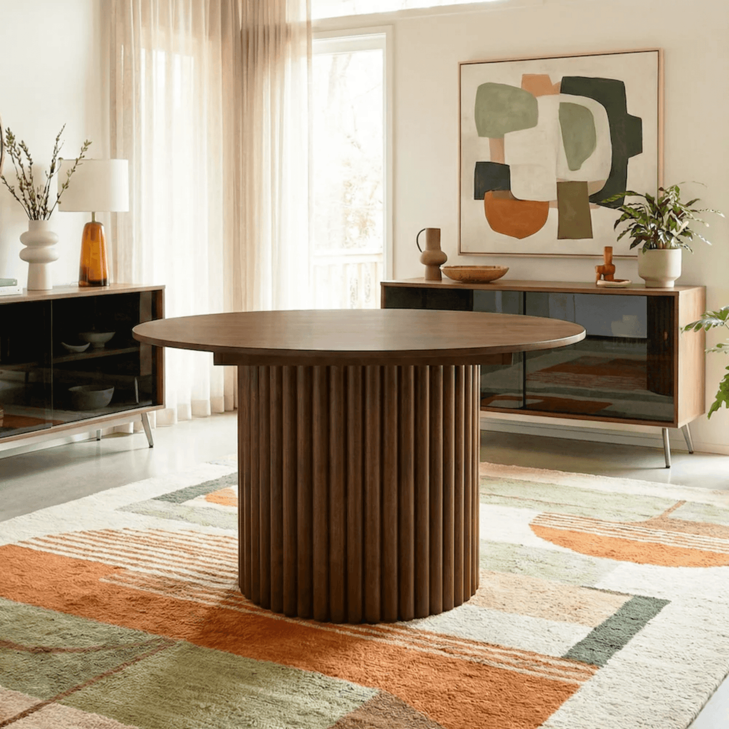 Merlin 35" Solid Wood Round Dining Table in Walnut with Ribbed Pedestal Base showcased in elegant dining room setting.