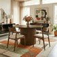 Merlin 35" Solid Wood Round Dining Table in Walnut with Ribbed Pedestal Base surrounded by stylish chairs and decor.