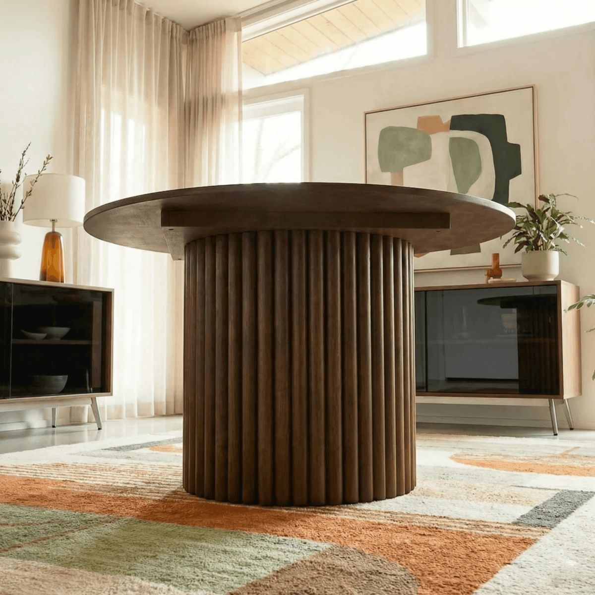 Merlin 35" Solid Wood Round Dining Table in Walnut with Ribbed Pedestal Base showcased in a modern dining space.