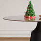 Round Mid-Century Modern Dining Table with Glass Top 35" decorated for Christmas with presents and a small tree.