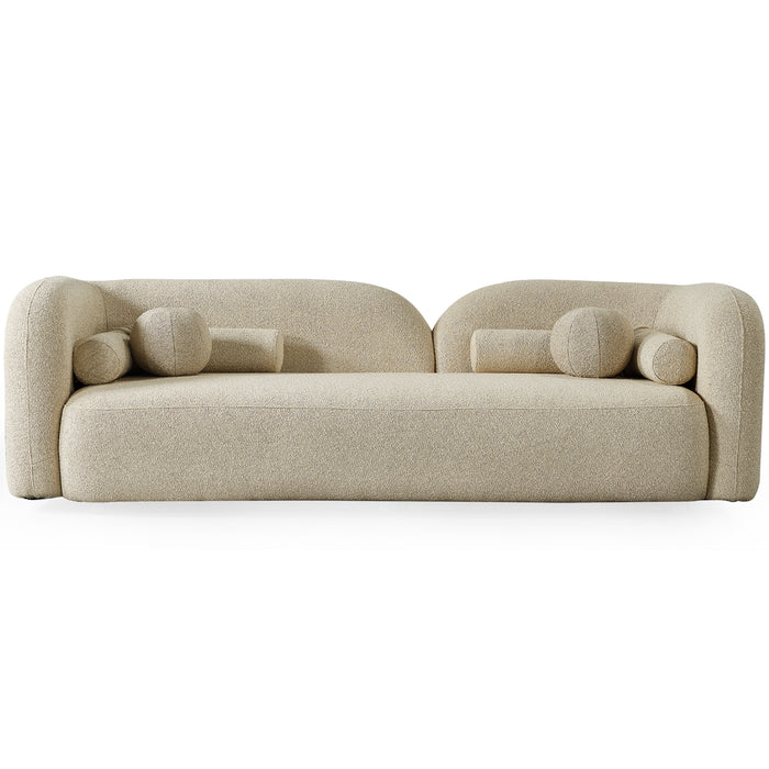 The Ashcroft Furniture Donna Minimalist Curved Boucle Sofa 93 features a modern beige design with rounded edges, a low backrest, four cylindrical bolster pillows, and soft textured upholstery for a luxurious feel.