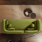 Minimalist Curved Boucle Sofa 93” – Donna Modern Sculptural Couch (3 Colors) in green, with round cushions.