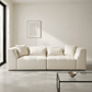 Jefferson 98" Modern Beige Chenille Sofa with Tuxedo Arms & Accent Pillows in a contemporary living room setting.