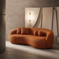 Modern Boucle Upholstered Curved Japandi Sofa 89” – Sculptural Minimalist Couch in orange fabric.