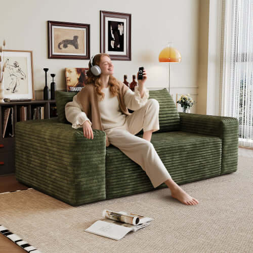 Modern Corduroy Deep Seat Loveseat Sofa – Comfy Couch (4 Colors and 3 Sizes) in green with a woman relaxing.