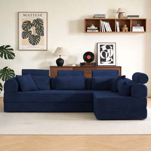Modern Corduroy Sleeper Sectional – L-Shape Modular Sofa Bed (106” Convertible Couch) in navy blue fabric with pillows.