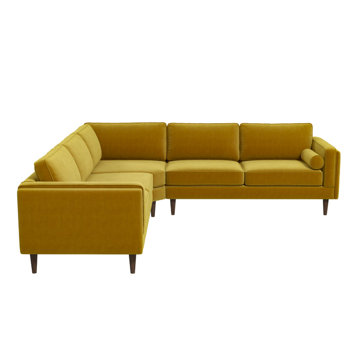 The Amber MCM Corner Sectional Sofa by Ashcroft Furniture in mustard yellow features clean lines, three back cushions, a bolster pillow, and dark wooden legs. Shown here in a modern L-shape against a white background.