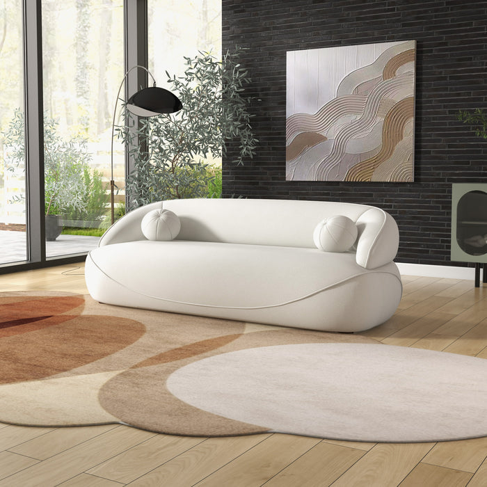 Modern Curved Boucle Sofa 84” (3 Colors) – Andrew Minimalist Sculptural Couch in a stylish living room setting.