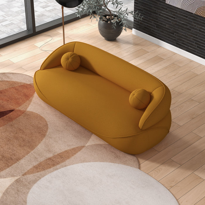 Modern Curved Boucle Sofa 84” (3 Colors) – Andrew Minimalist Sculptural Couch in warm yellow upholstery.