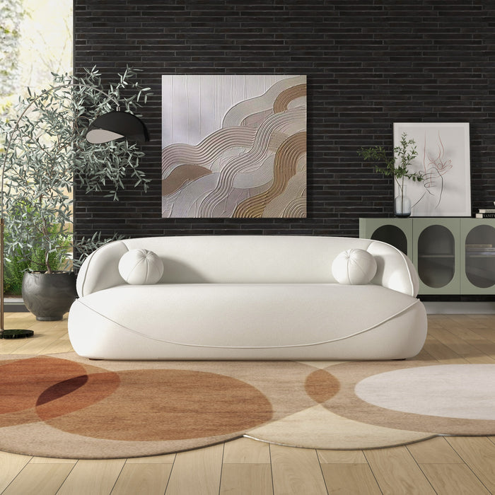 Modern Curved Boucle Sofa 84” (3 Colors) – Andrew Minimalist Sculptural Couch in a stylish living room setting.