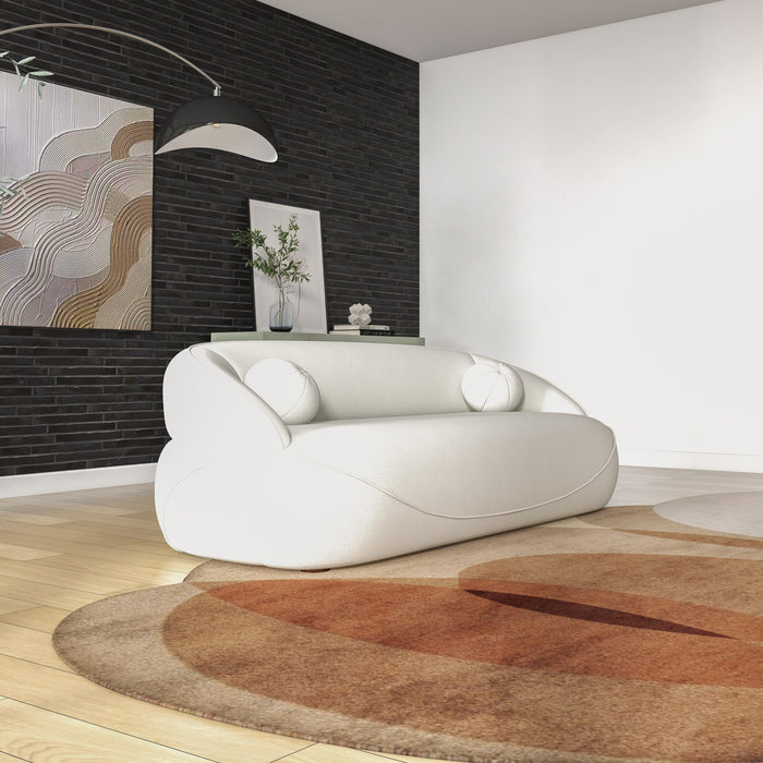 Modern Curved Boucle Sofa 84” (3 Colors) – Andrew Minimalist Sculptural Couch in a stylish living room setting.