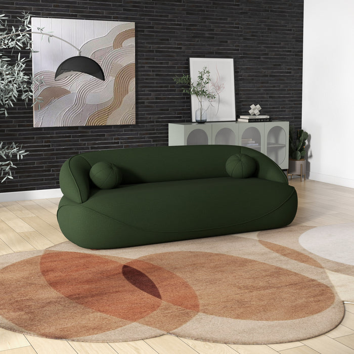 Modern Curved Boucle Sofa 84” (3 Colors) – Andrew Minimalist Sculptural Couch in green fabric, set in a stylish living room.