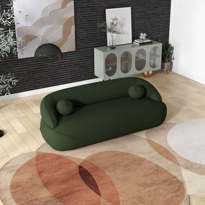 Modern Curved Boucle Sofa 84” (3 Colors) – Andrew Minimalist Sculptural Couch in green color, set in a stylish living room.