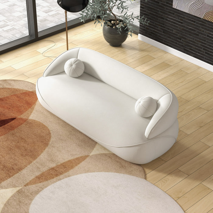 Modern Curved Boucle Sofa 84” (3 Colors) – Andrew Minimalist Sculptural Couch in a cozy living room setting.
