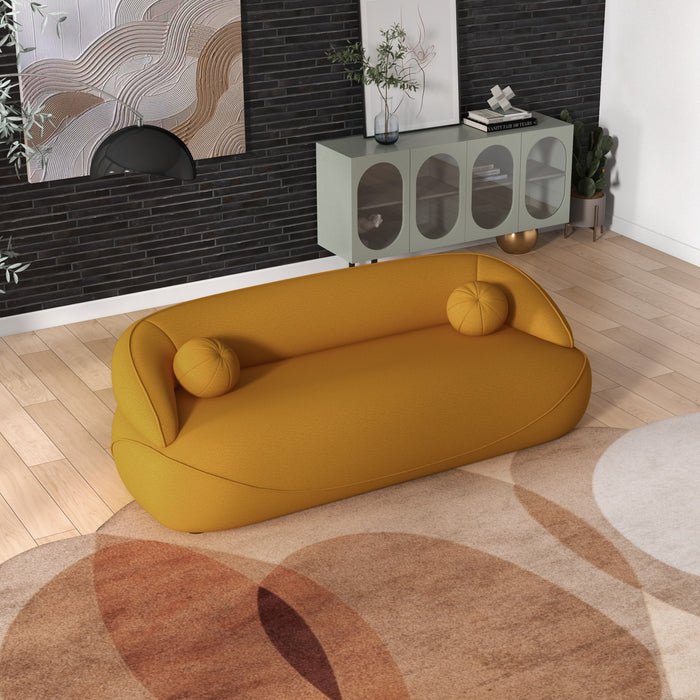 Modern Curved Boucle Sofa 84” (3 Colors) – Andrew Minimalist Sculptural Couch in a warm yellow fabric, enhancing contemporary living room design.