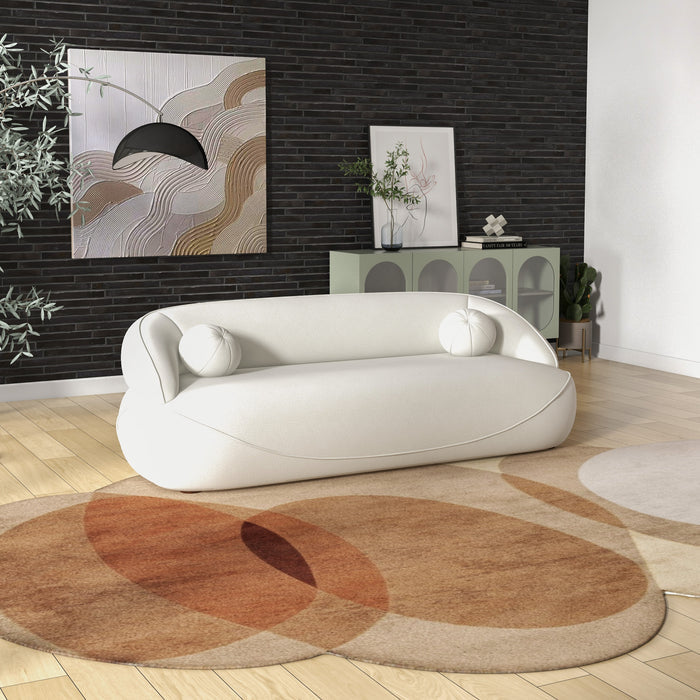Modern Curved Boucle Sofa 84” (3 Colors) – Andrew Minimalist Sculptural Couch in a stylish living room setting.