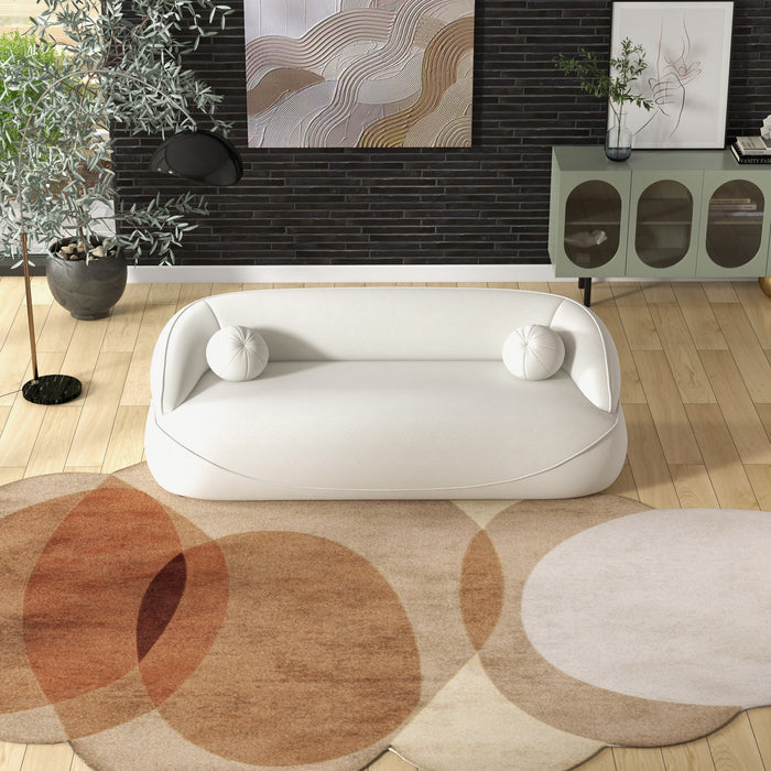 Modern Curved Boucle Sofa 84” (3 Colors) – Andrew Minimalist Sculptural Couch in a stylish living room setting.