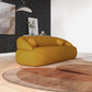 Modern Curved Boucle Sofa 84” (3 Colors) – Andrew Minimalist Sculptural Couch in a vibrant yellow hue.
