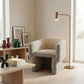 Wichita Chenille Lounge Chair – Modern Curved Accent Chair (Brown or Gold) in a stylish living room setting.