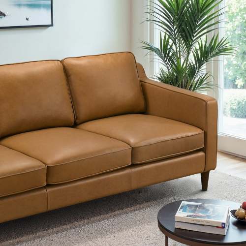 Modern Genuine Leather 3 Seat Sofa 81” – Cooper MCM Tan Leather Couch in a stylish living room setting with plants.
