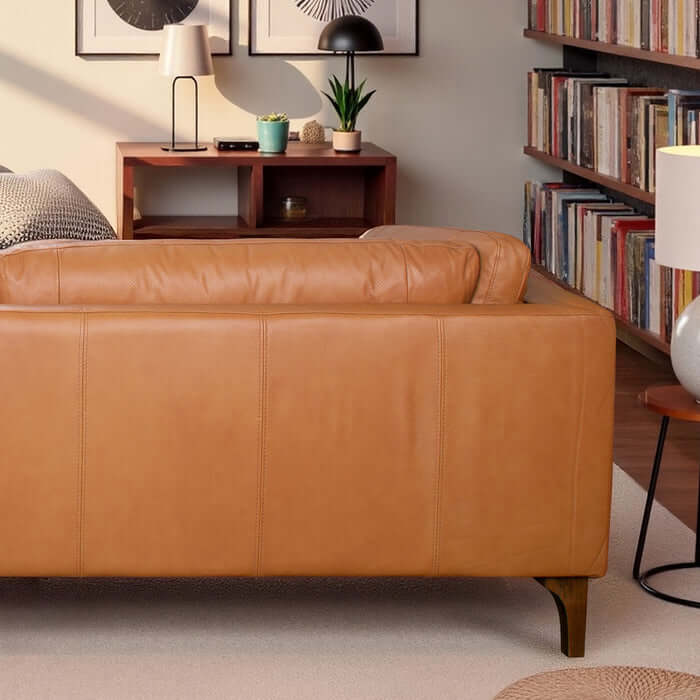 Bellrose MCM Genuine Leather Sofa 93W in rich tan color with sleek walnut legs showcased in a stylish living room setting.