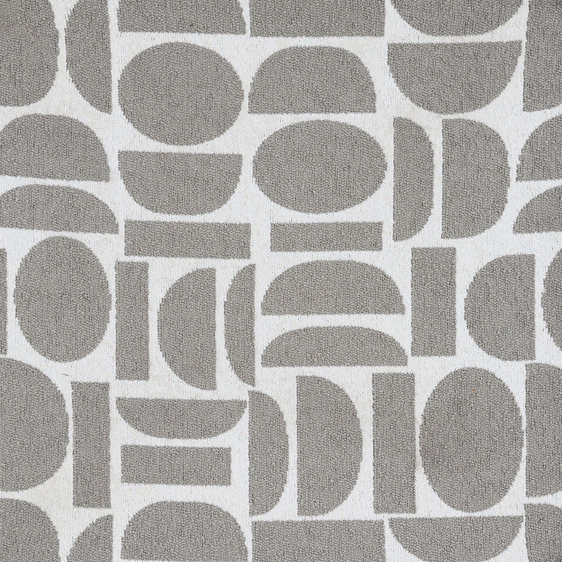 Geometric gray and white patterned fabric suitable for upholstery or home decor.