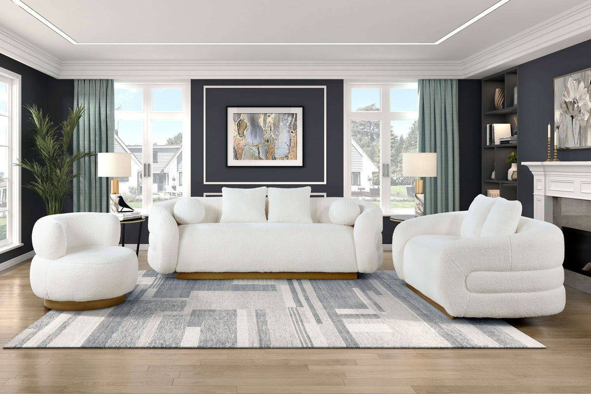 Cozy living room featuring a white sherpa loveseat with a stylish gold base and modern decor.