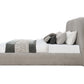 Orane Gray Fabric Queen Bed Platform w/Storage side view with cushions and bedding arranged.