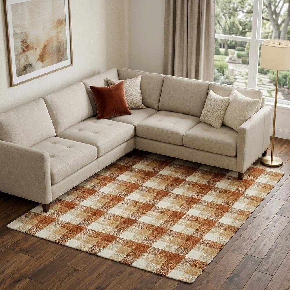 Orange Beige And Brick Red Wool Plaid Hand Tufted Area Rug | 9' x 13' placed under a stylish sectional couch.