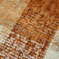 Orange Beige And Brick Red Wool Plaid Hand Tufted Area Rug | 9' x 13' close-up texture detail.