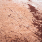 Orange Brown And White Abstract Washable Area Rug With UV Protection Area Rug | 9' x 13' close-up texture view.